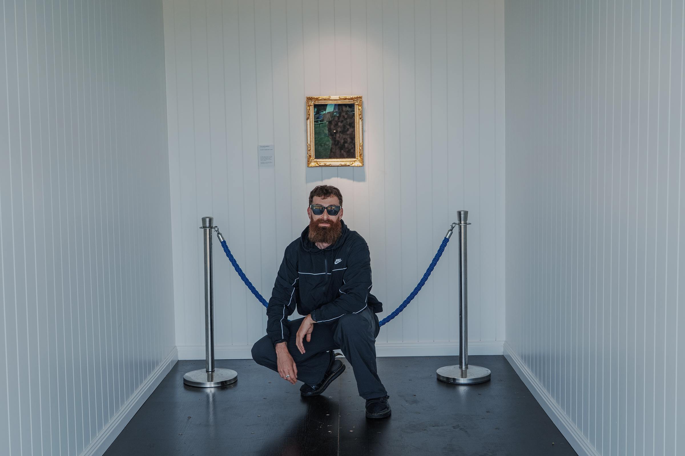 Nate Don, posed inside the installed gallery.